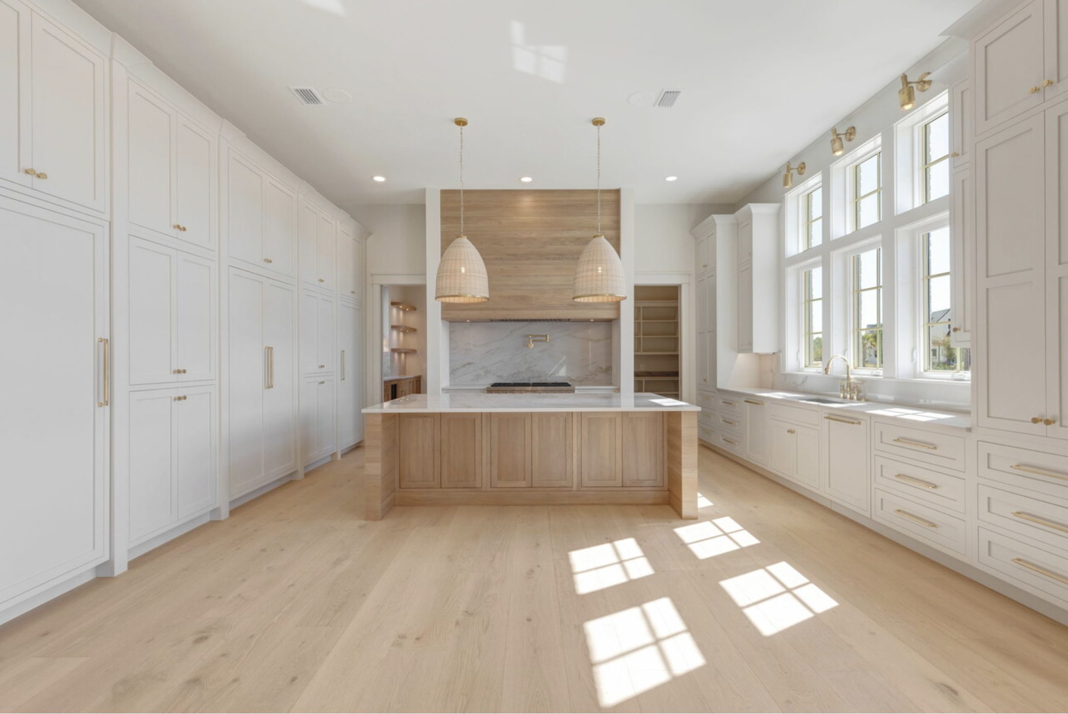 White oak island kitchen with painted perimeter cabinetry