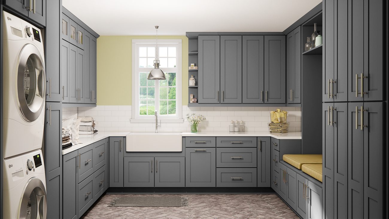 Grey laundry room with full-height storage and a farmhouse sink